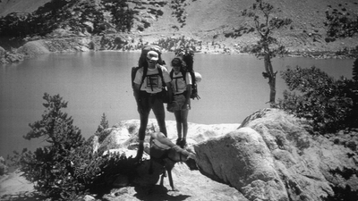 A historical picture of Ruffwear founder Patrick Kruse, his friend, and a dog..