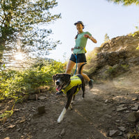 Woman running with her dog. 