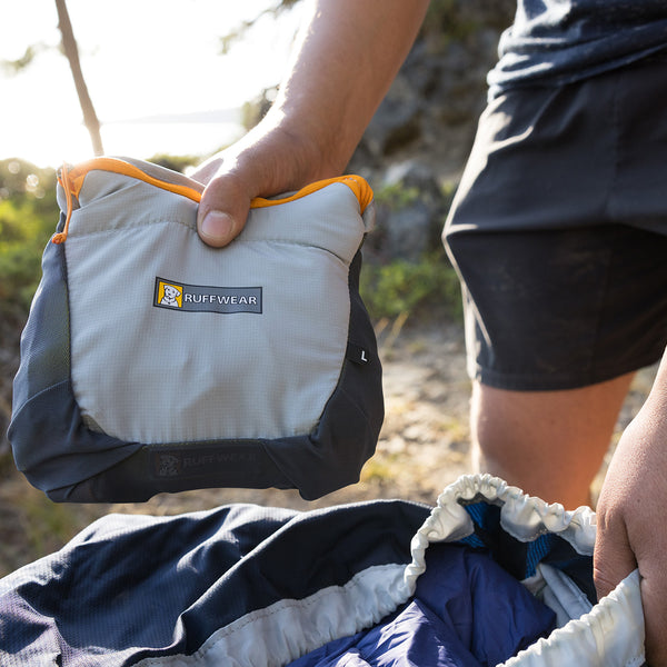 Person holding packed up BackTrak Dog Emergency Evacuation Kit