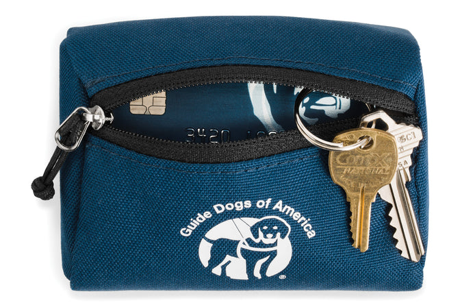 Guide dog pouch unzipped with items inside and keys on keychain.