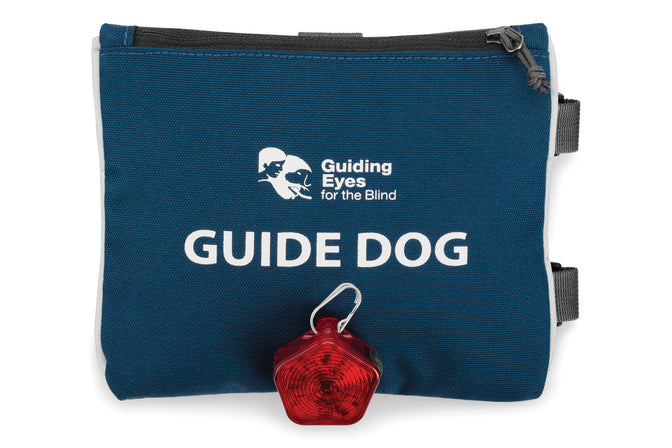 Guide dog sign with zipper on top and beacon attached to loop on front.